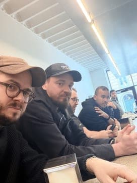 Propane team gathered at a café counter